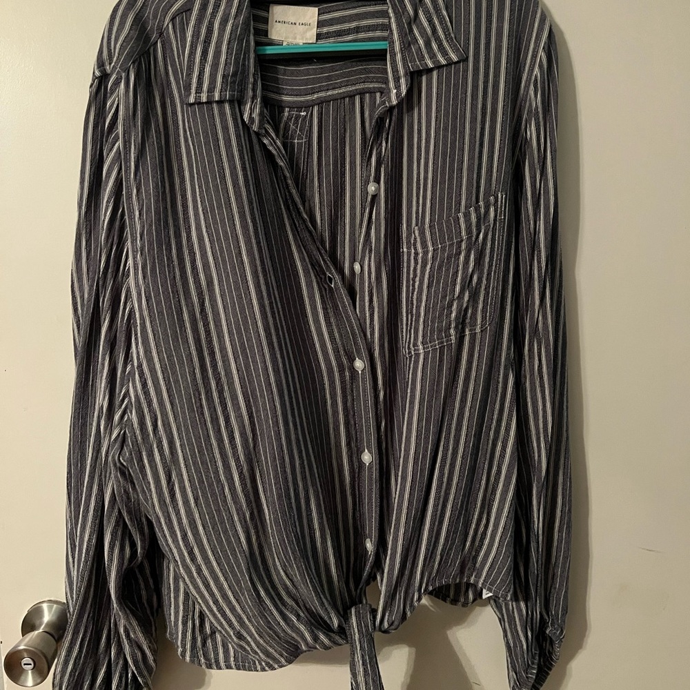 Long sleeve, navy and white stripped, button up shirt.